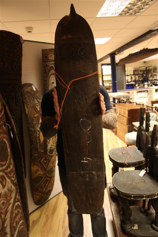 Sepik River carved wooden gope board and two other boards